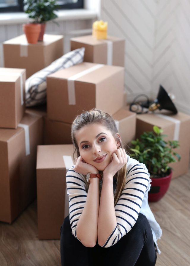 https://webuyhousesdfw.com/wp-content/uploads/2024/08/woman-finished-with-cargo-packages-is-sitting-boxes-floor-scaled-e1723934102259-640x894.jpg